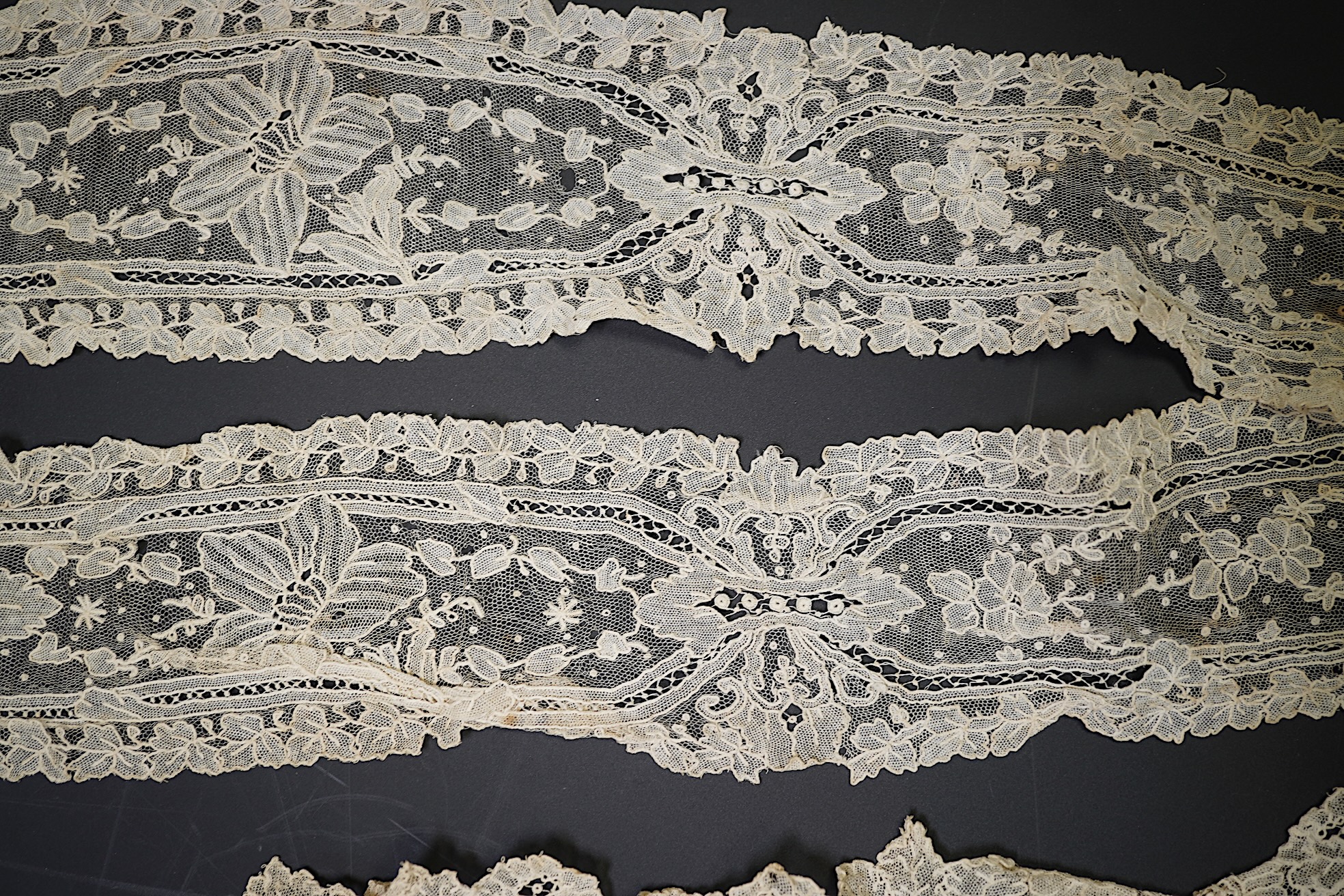 A 19th century Brussels Point de Gaz needle lace collar, lappet and wedding hankie, possibly part of a trousseau. The collar having thirty four needle lace raised flower heads within the design. The collar 100cm long x 1